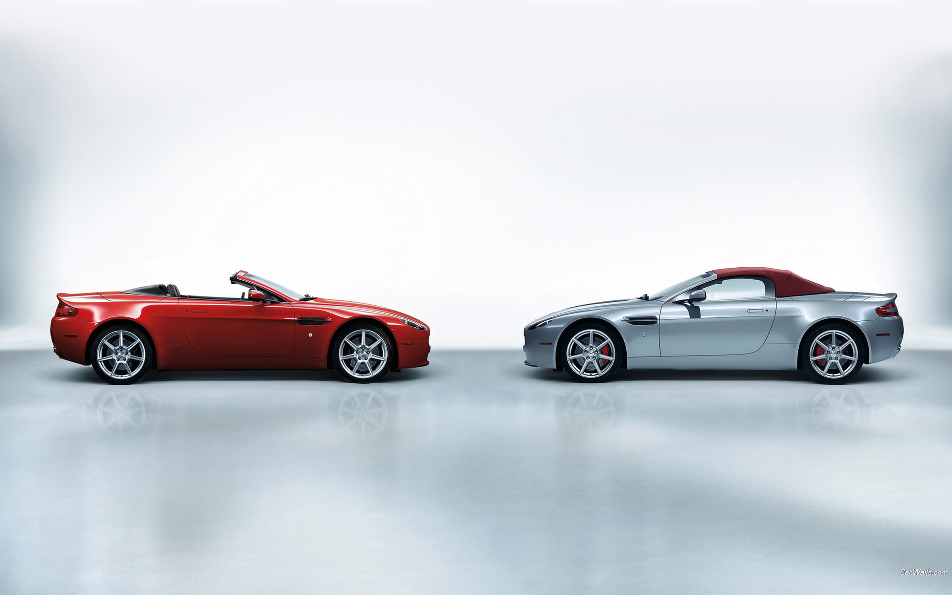 Download HQ Vantage Roadster red vs blue Aston Martin wallpaper / 1920x1200