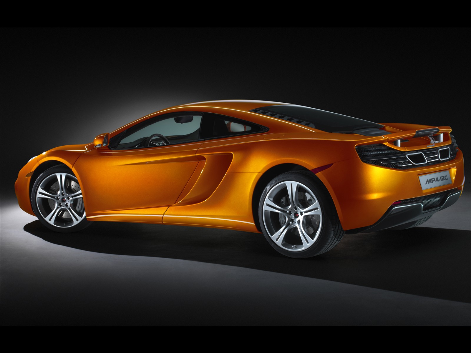 Download High quality MP4-12C orange side McLaren wallpaper / 1600x1200