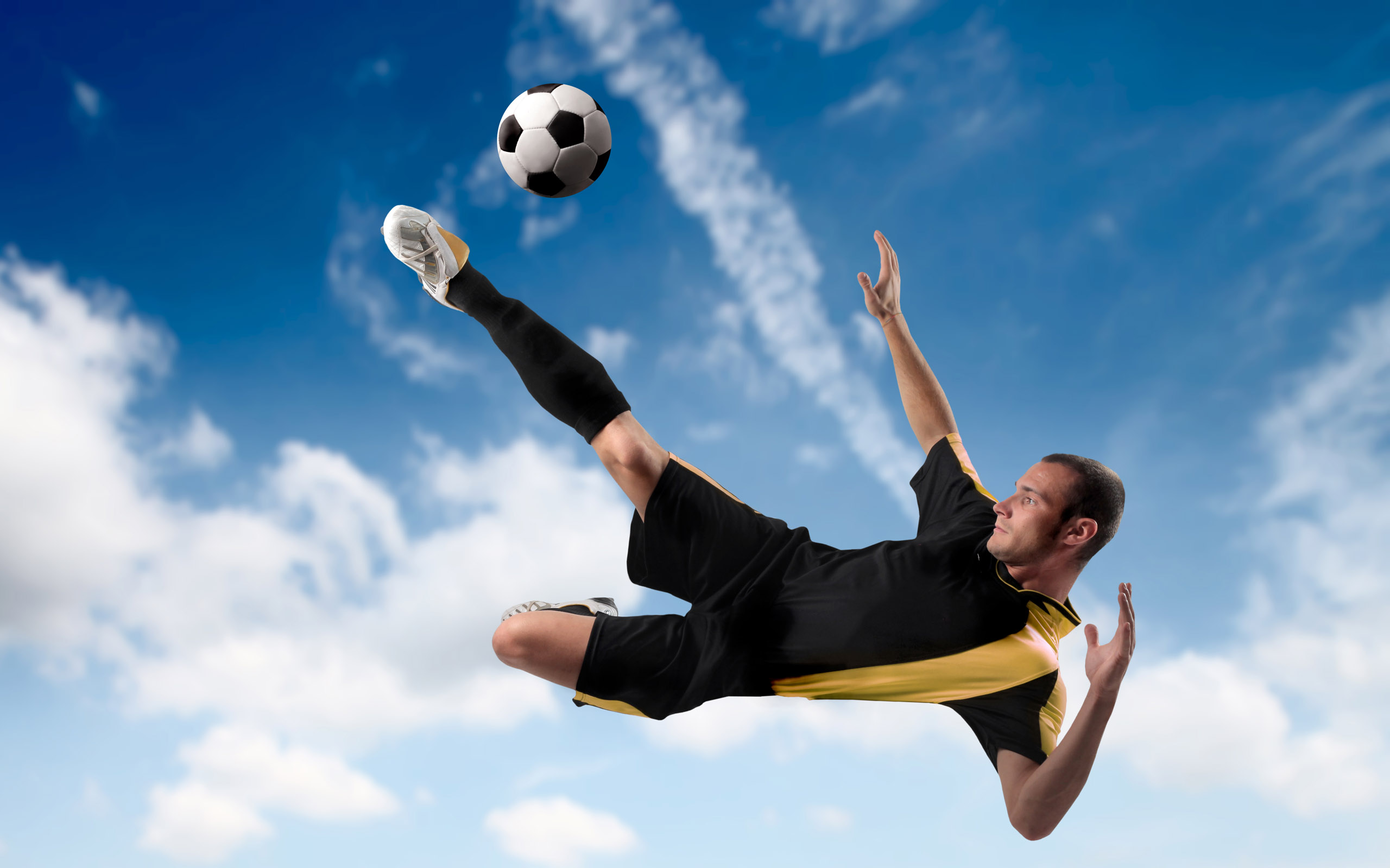 Download full size Kick the ball in flight Football wallpaper / 2560x1600