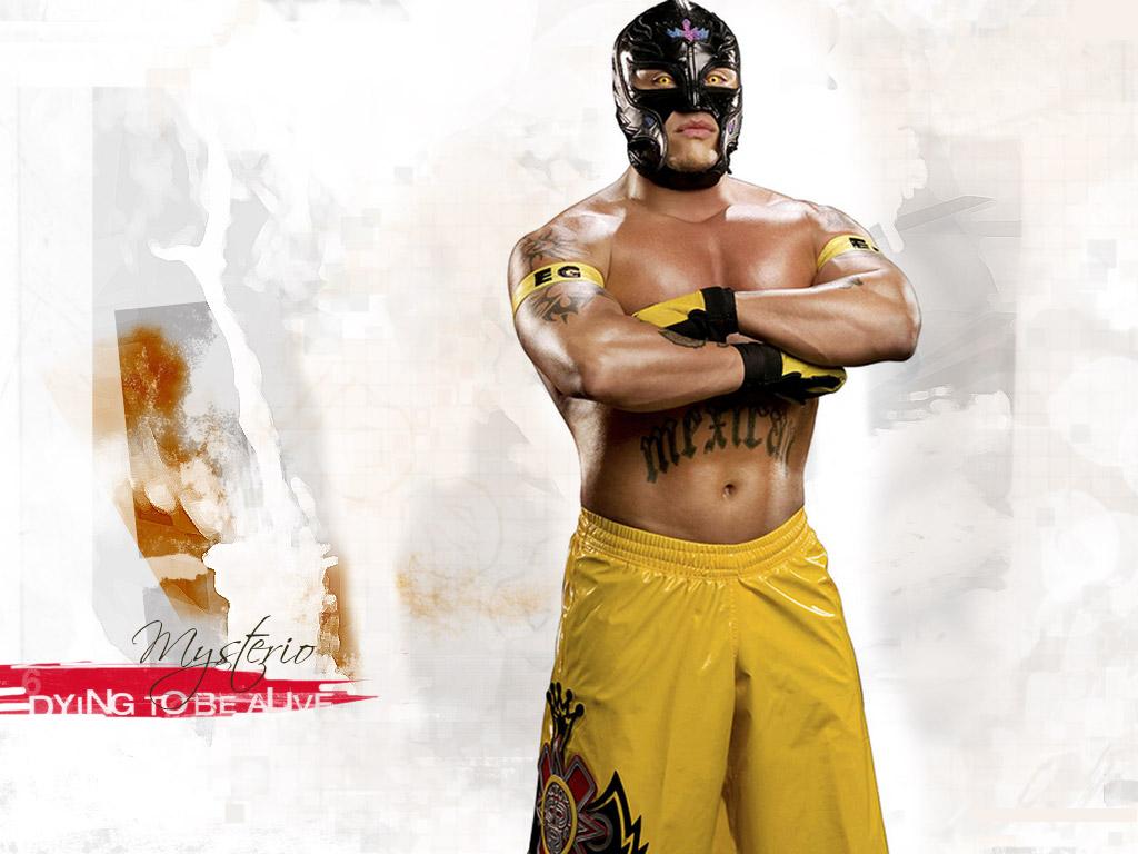 Full size Rey Mysterio In the leather mask and in yellow shorts Wrestling WWE wallpaper / 1024x768